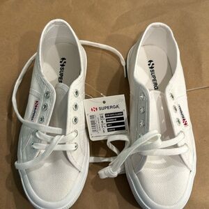 NEVER WORN with tags. SuperGa sneakers. Size 7.5 smoke free pet free home.